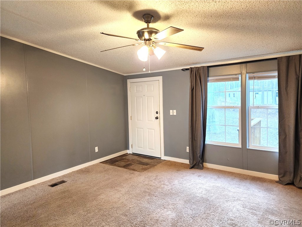 1609 Jeter Road Powhatan, VA 23139 - Photo 6 of 30 an empty room with fan and windows