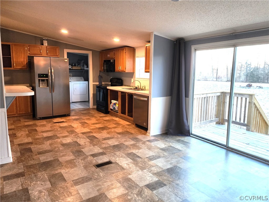 1609 Jeter Road Powhatan, VA 23139 - Photo 9 of 30 a large kitchen with a stove a refrigerator and a large window
