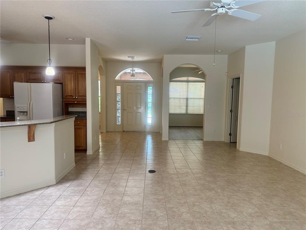 11145 Northwest 17th Court Road Ocala, FL 34475 - Photo 21 of 59 a view of a kitchen with a sink and a chandelier