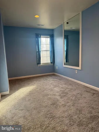 a kitchen with wooden cabinets and a stove top oven