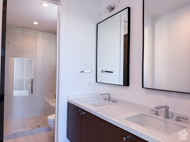 2132 East Outlaw Road, Unit 49 Kamas, UT 84036 - Photo 31 of 44 Full bath with a shower stall, double vanity, and recessed lighting