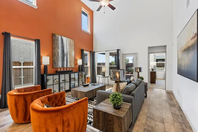 a living room with furniture and a potted plant