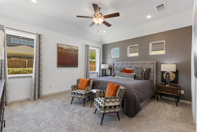 a bedroom with furniture and a window