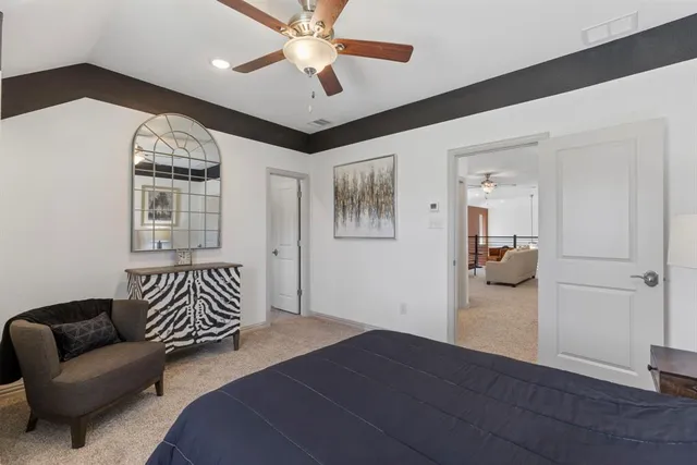 a bedroom with furniture and a chandelier