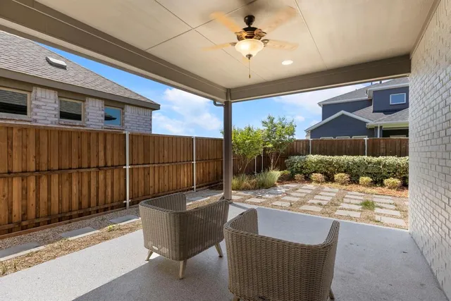 a outdoor living space with furniture and a potted plant