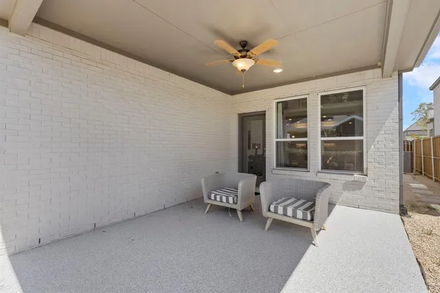 a living room with furniture and window