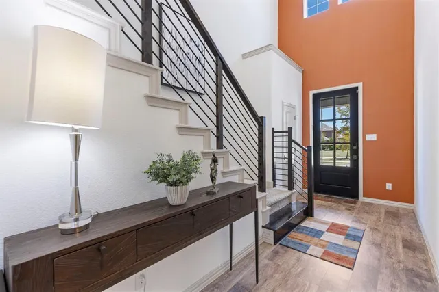 a view of entryway and hall with a potted plant