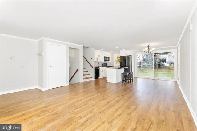 a view of kitchen with furniture and wooden floor
