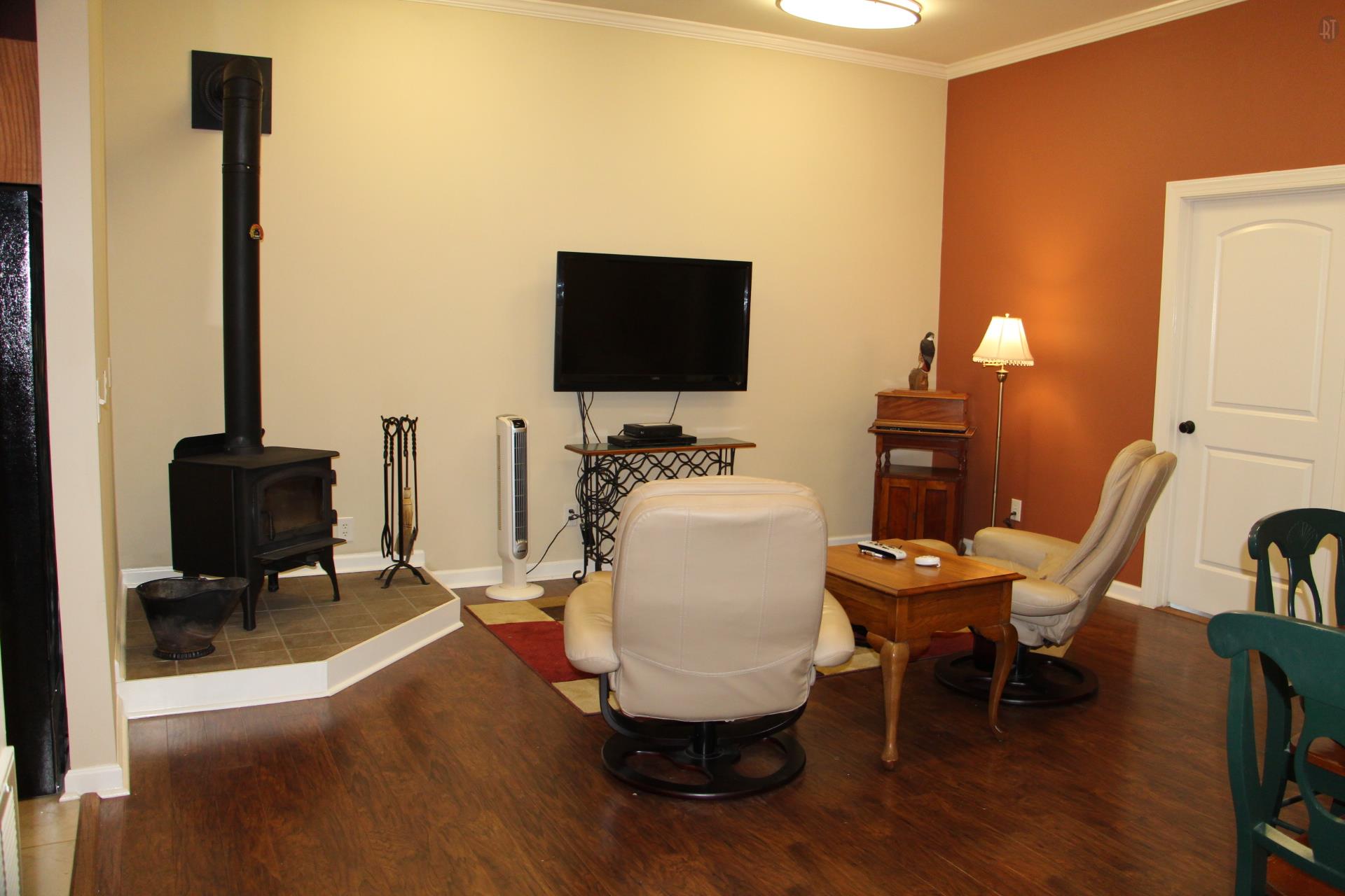 2341 Gunn Road Springfield, TN 37172 - Photo 16 of 27 a living room with furniture a flat screen tv and a table