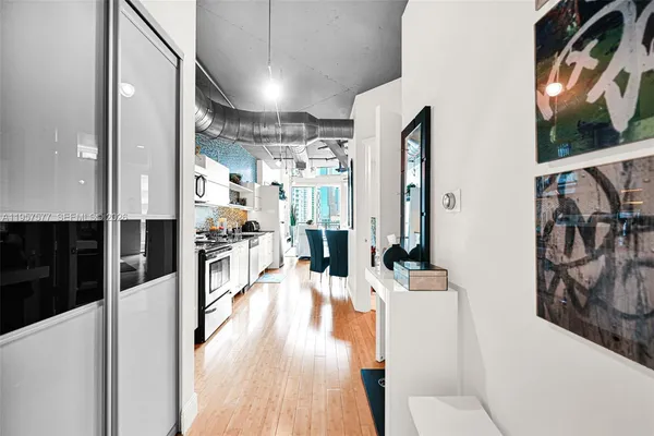 a view of washer and dryer with wooden floor