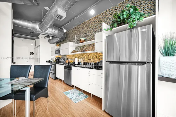 a work room with furniture and wooden floor