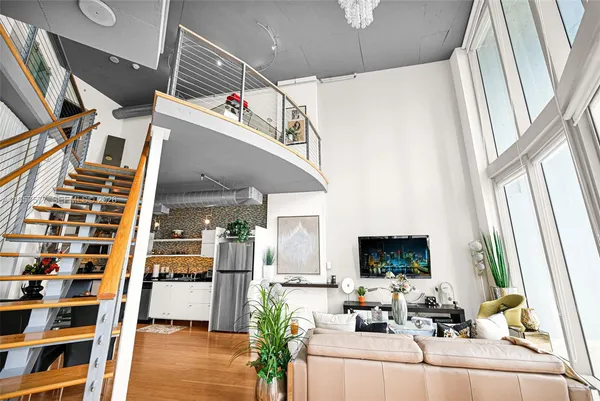 a living room with furniture or couch and a wooden floor