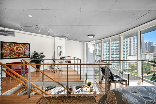a bedroom with furniture and wooden floor
