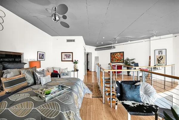 a living room with lots of furniture and a flat screen tv