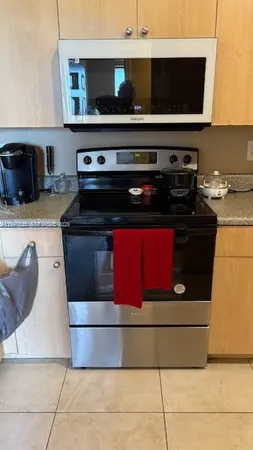 a white refrigerator freezer sitting in a kitchen