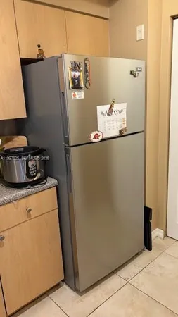 a kitchen with a stove and a refrigerator