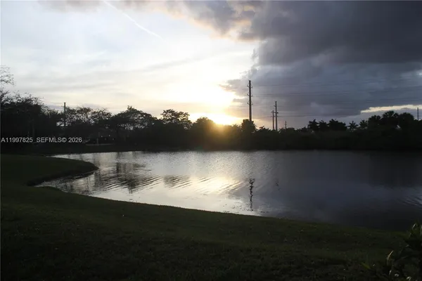 a view of a lake with a city