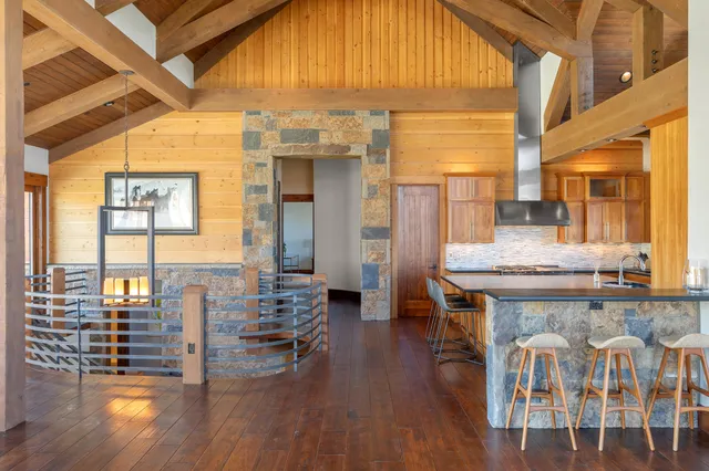 a bedroom with a large bed and a large window