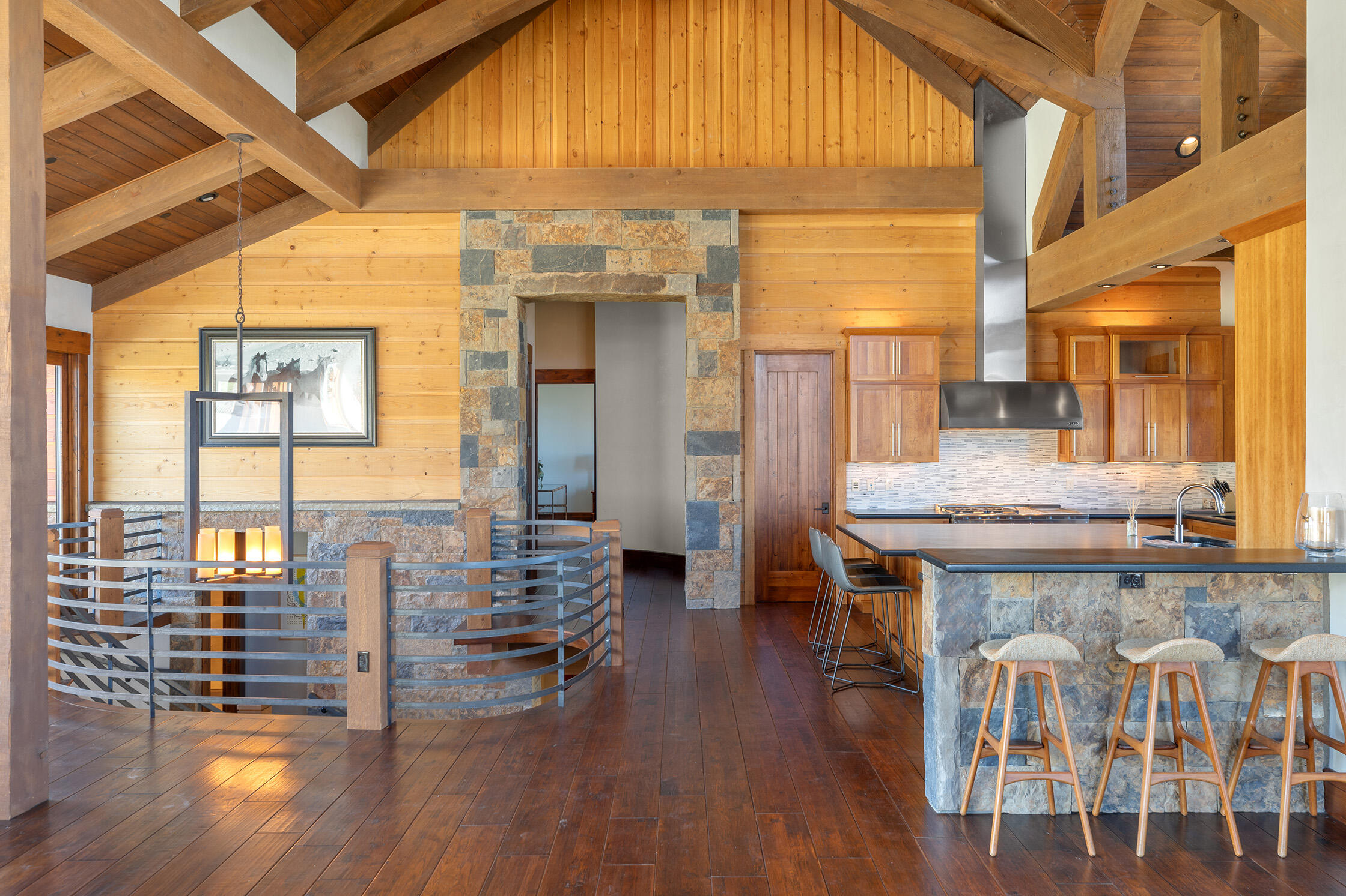 1221 Cornerstone Loop Montrose, CO 81403 - Photo 12 of 44 a kitchen with a table chairs stove and wooden floor
