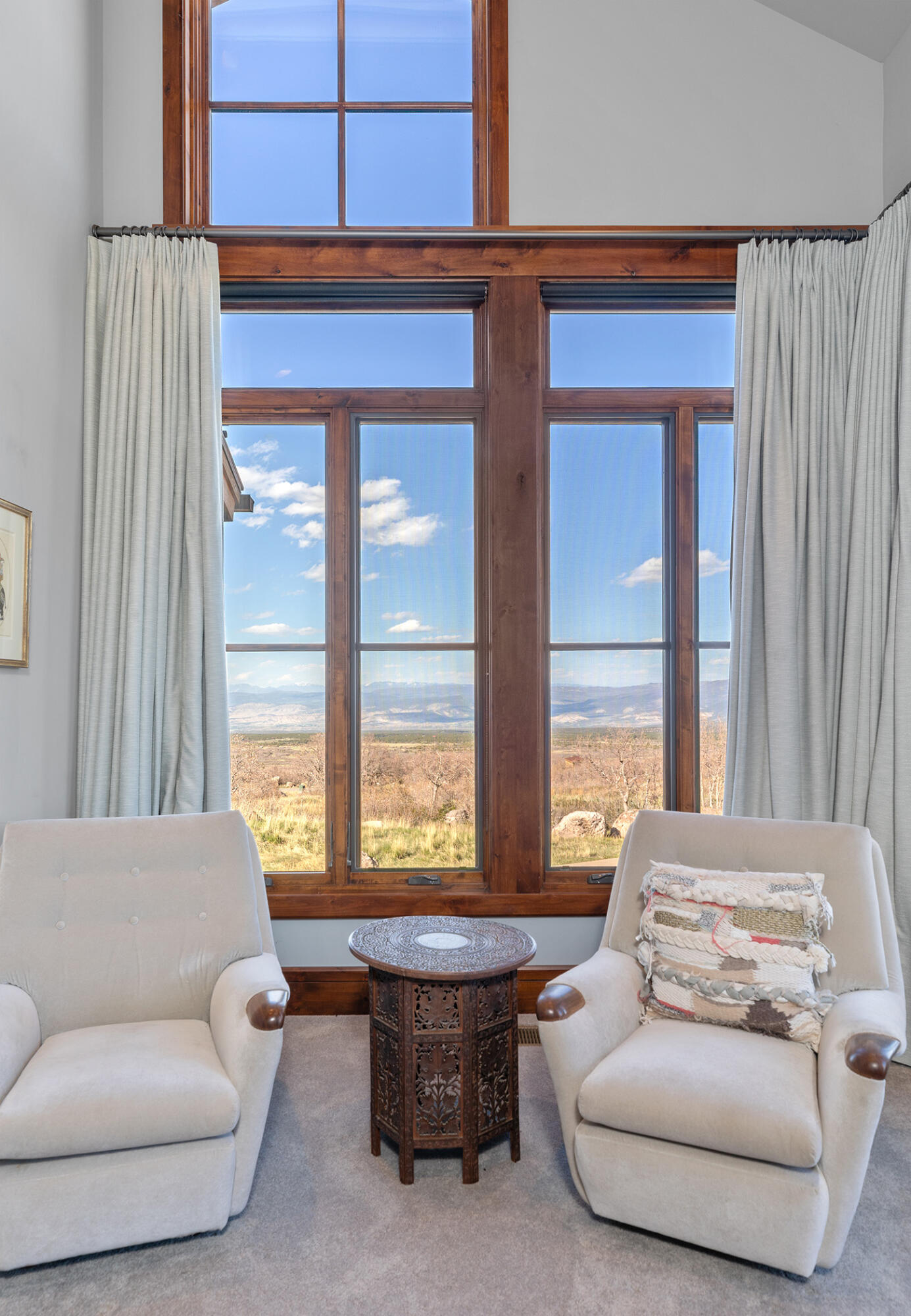 1221 Cornerstone Loop Montrose, CO 81403 - Photo 21 of 44 a living room with furniture and a large window