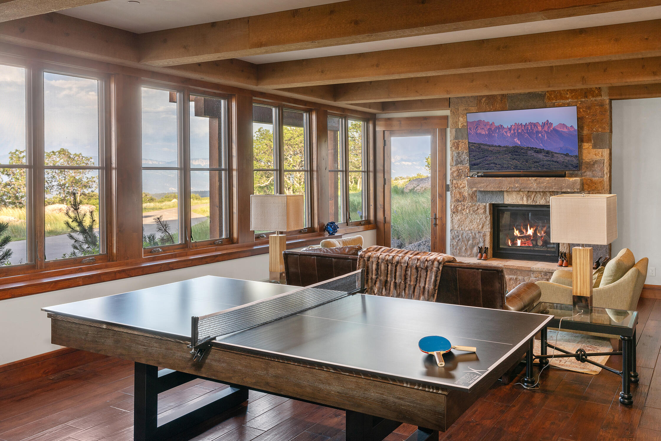 1221 Cornerstone Loop Montrose, CO 81403 - Photo 28 of 44 a living room with furniture pool table and a large window