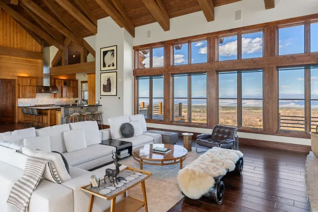 a view of a balcony with wooden floor and city view
