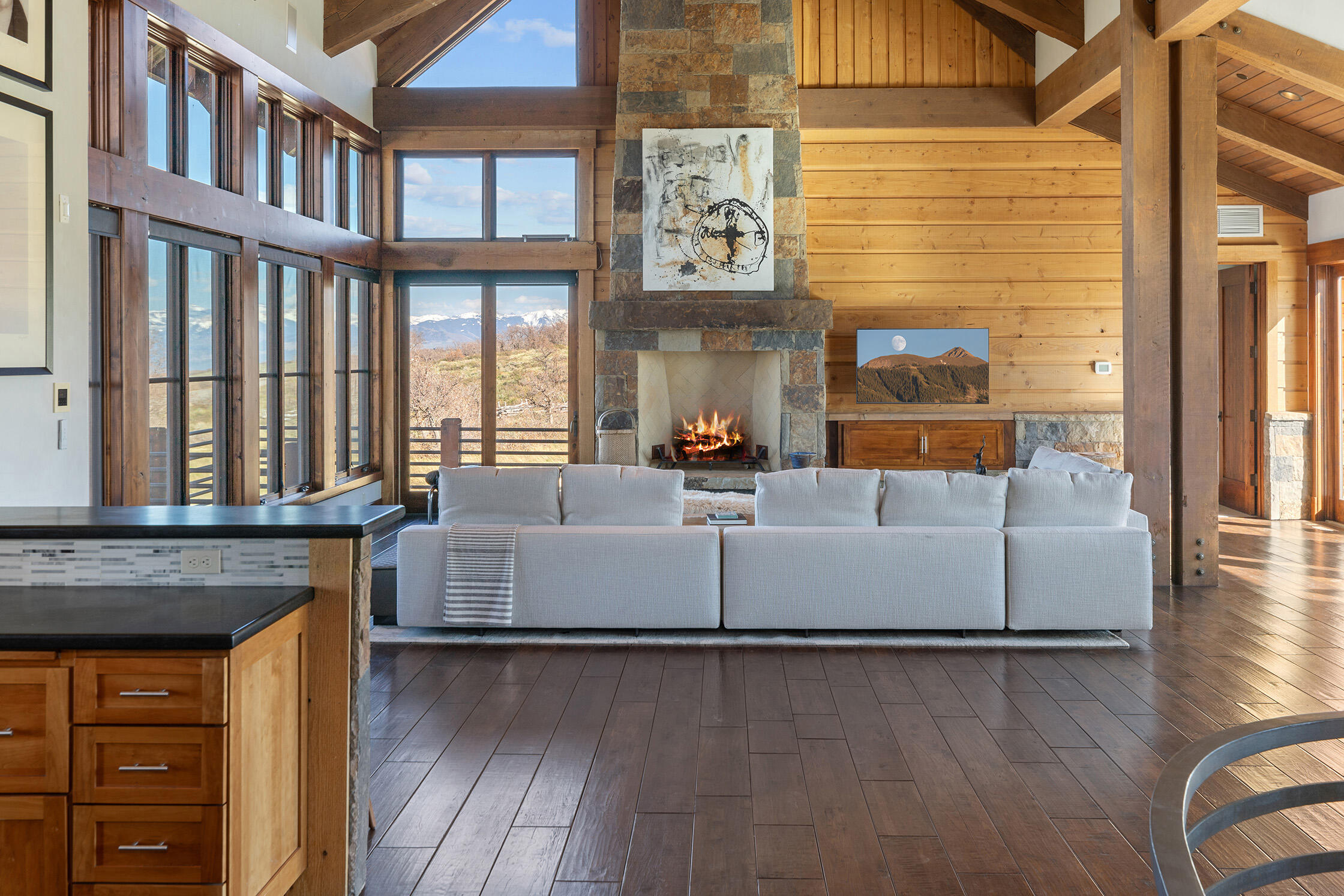 1221 Cornerstone Loop Montrose, CO 81403 - Photo 10 of 44 a living room with furniture and a floor to ceiling window