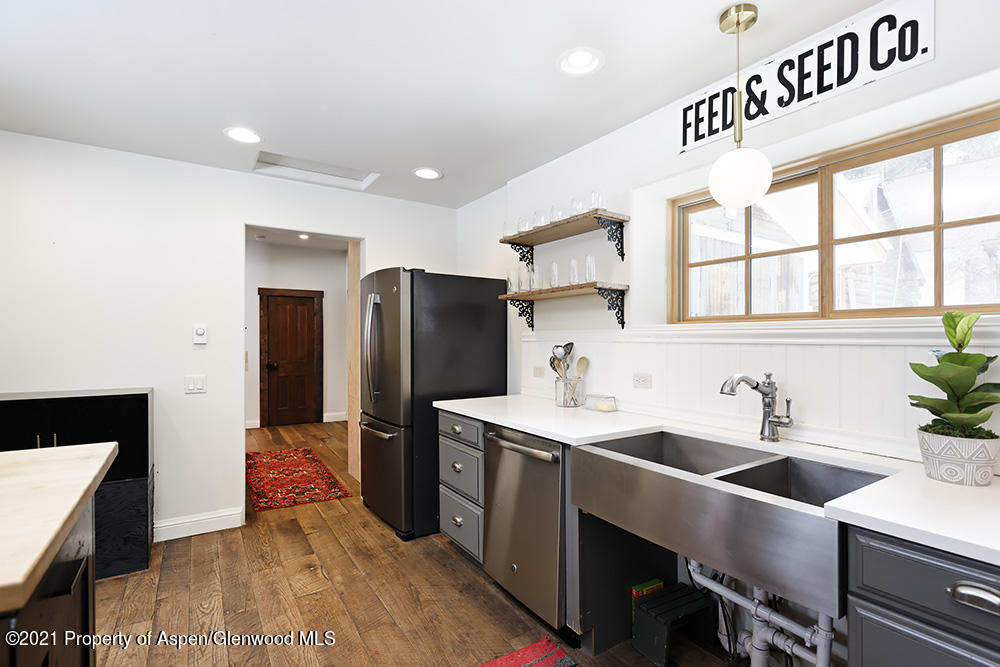 113 West State Street Marble, CO 81623 - Photo 12 of 28 a kitchen that has a sink and a refrigerator