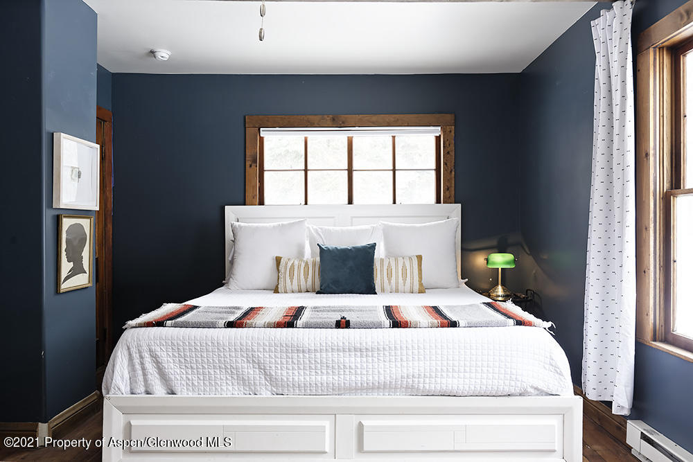 113 West State Street Marble, CO 81623 - Photo 13 of 28 a bedroom with a bed and a window