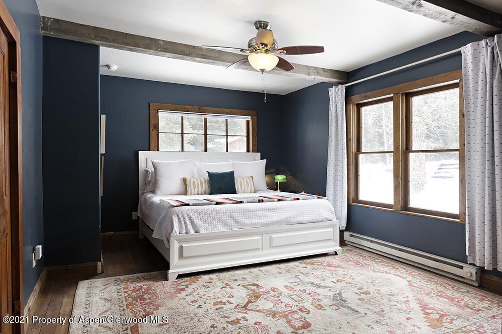 113 West State Street Marble, CO 81623 - Photo 14 of 28 a bedroom with a large bed and a window