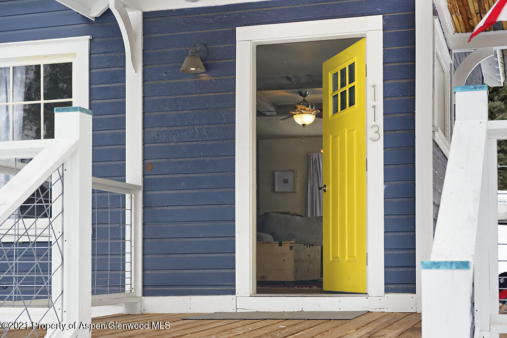 113 West State Street Marble, CO 81623 - Photo 2 of 28 a view of a brick house with a large door