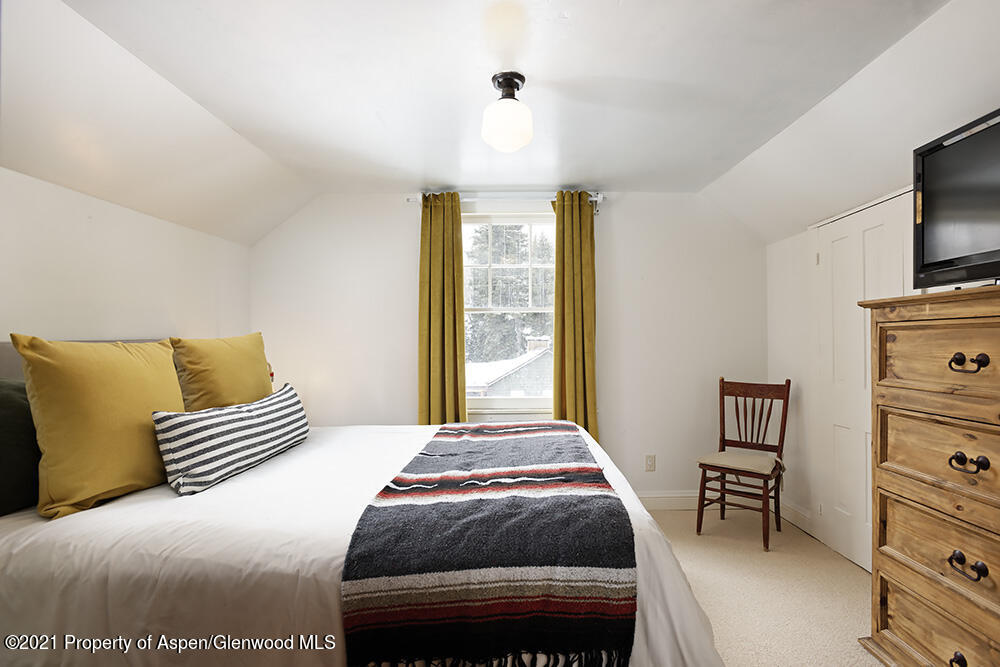 113 West State Street Marble, CO 81623 - Photo 21 of 28 a bedroom with a bed and a television