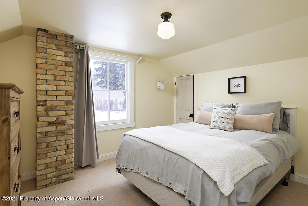 113 West State Street Marble, CO 81623 - Photo 22 of 28 a bedroom with a bed and a window