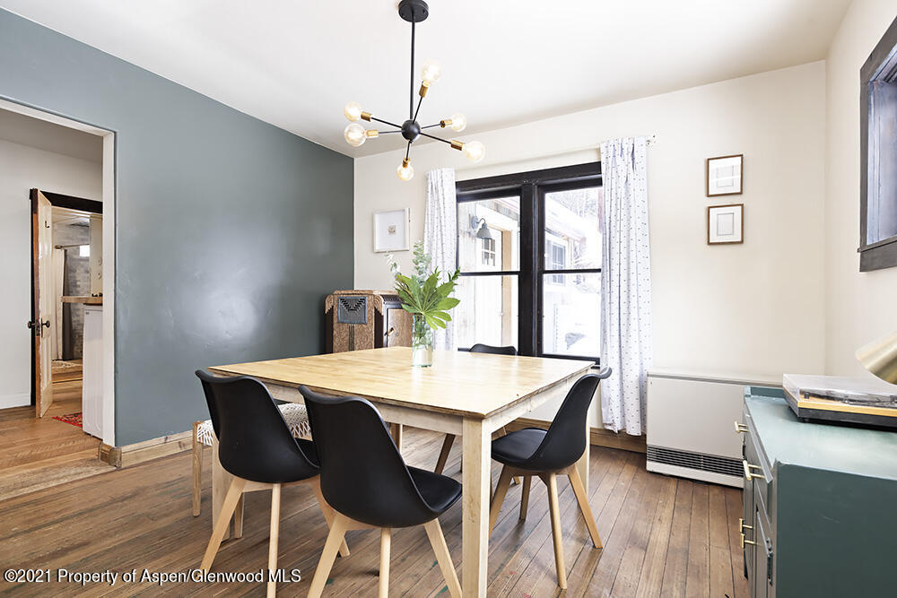 113 West State Street Marble, CO 81623 - Photo 6 of 28 a view of a dining room with furniture window and wooden floor