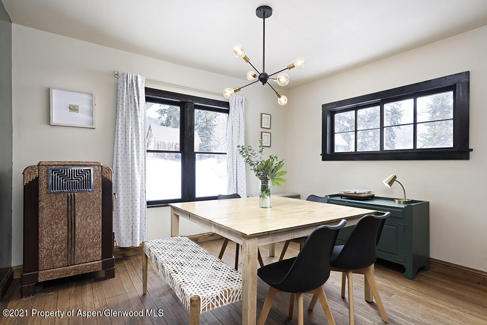 113 West State Street Marble, CO 81623 - Photo 7 of 28 a view of a dining room with furniture window and wooden floor