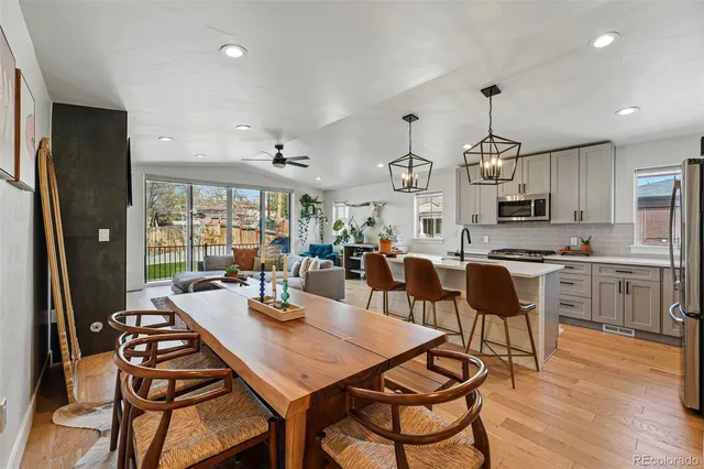 a view of a dining room with furniture window and wooden floor