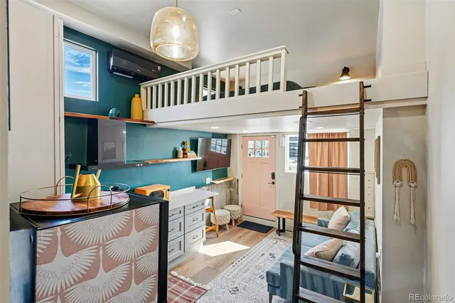 a dining room with furniture and a window