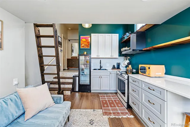 a kitchen with stainless steel appliances cabinets a sink and a stove