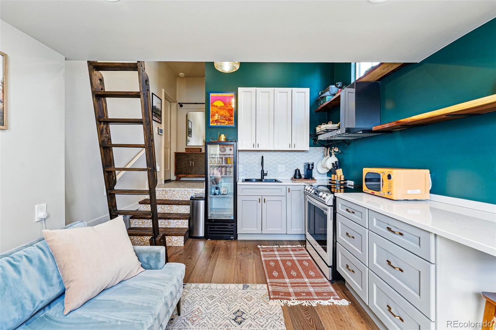 949 Raleigh Street, Unit 2 Denver, CO 80204 - Photo 33 of 42 a kitchen with stainless steel appliances cabinets a sink and a stove
