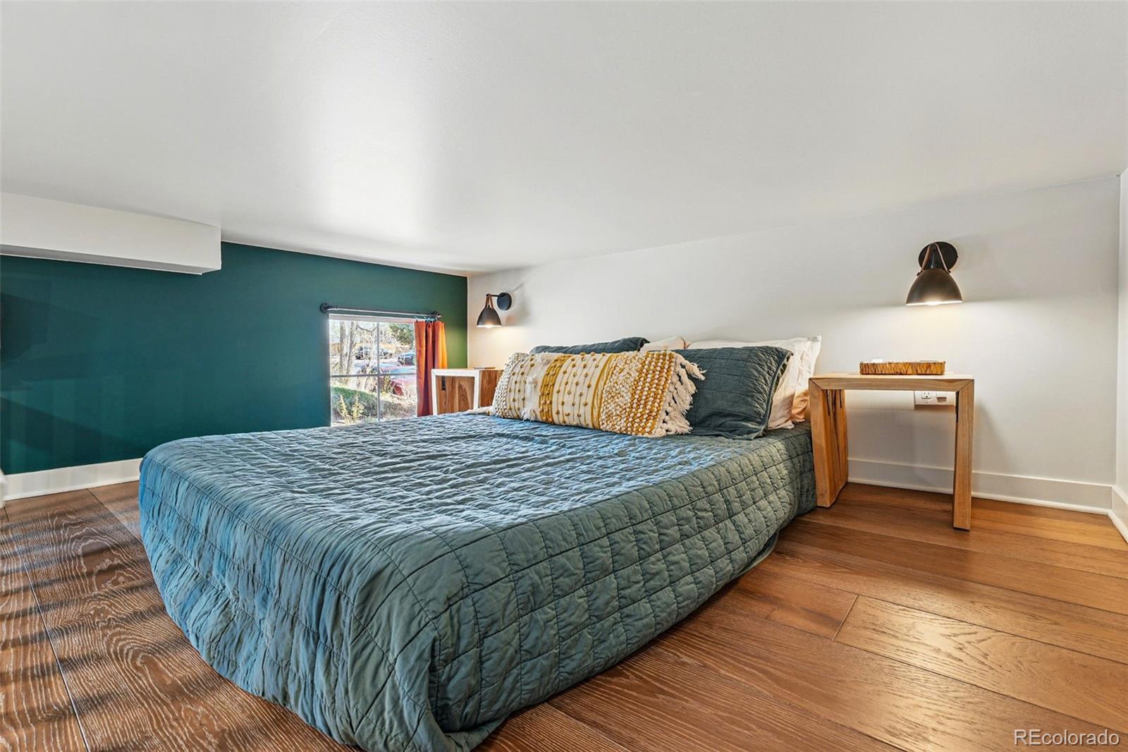 949 Raleigh Street, Unit 2 Denver, CO 80204 - Photo 35 of 42 a bedroom with a bed and wooden floor