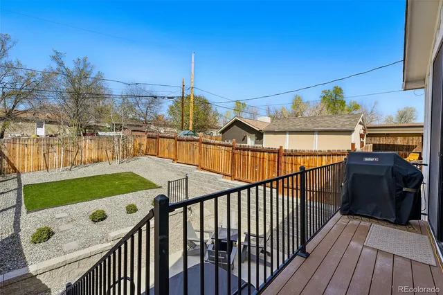 a view of a balcony and yard