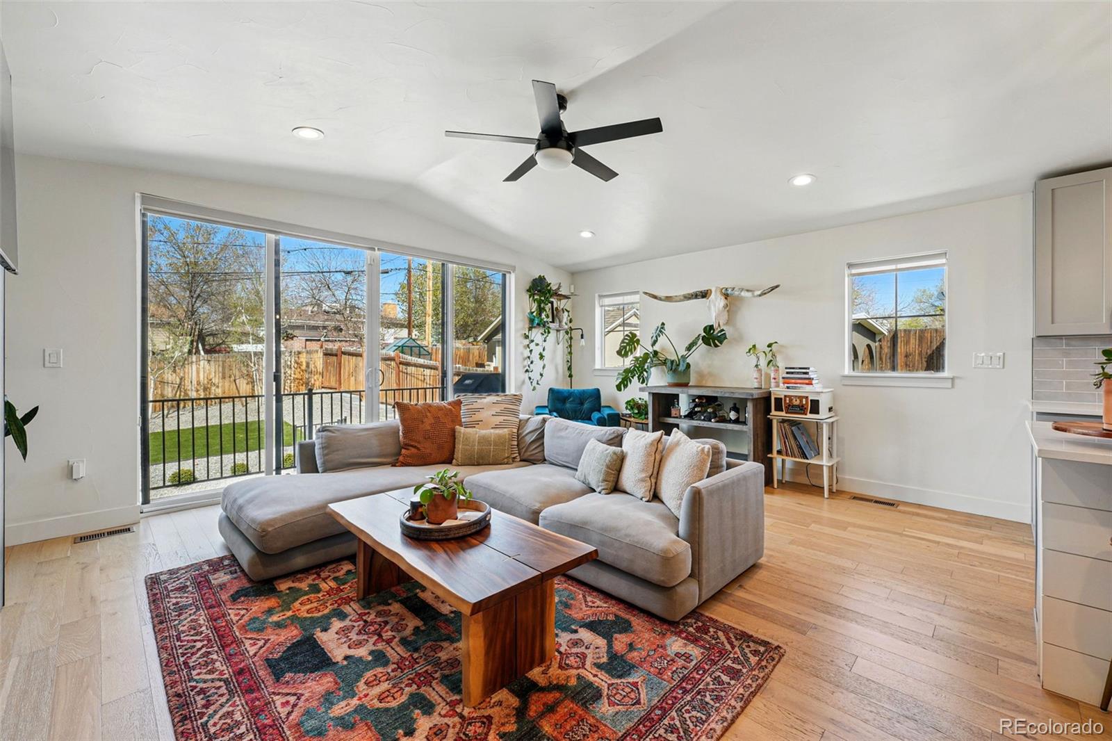 949 Raleigh Street, Unit 2 Denver, CO 80204 - Photo 5 of 42 a living room with furniture and a large window