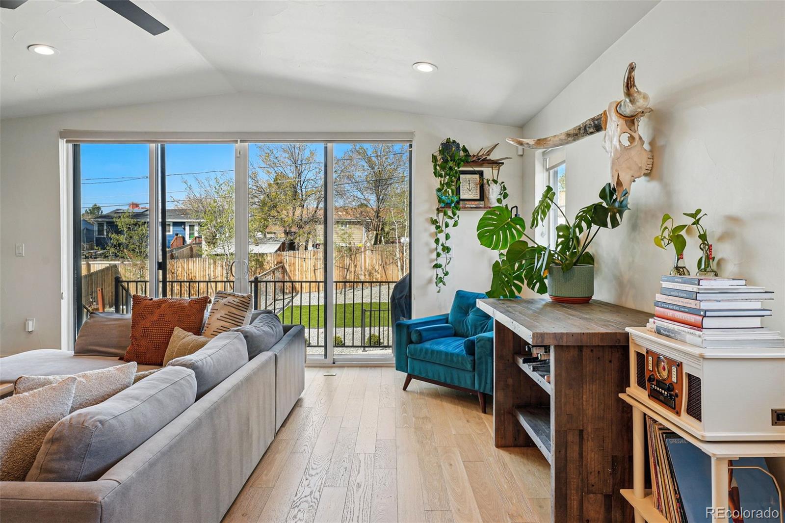 949 Raleigh Street, Unit 2 Denver, CO 80204 - Photo 8 of 42 a living room with furniture and a potted plant