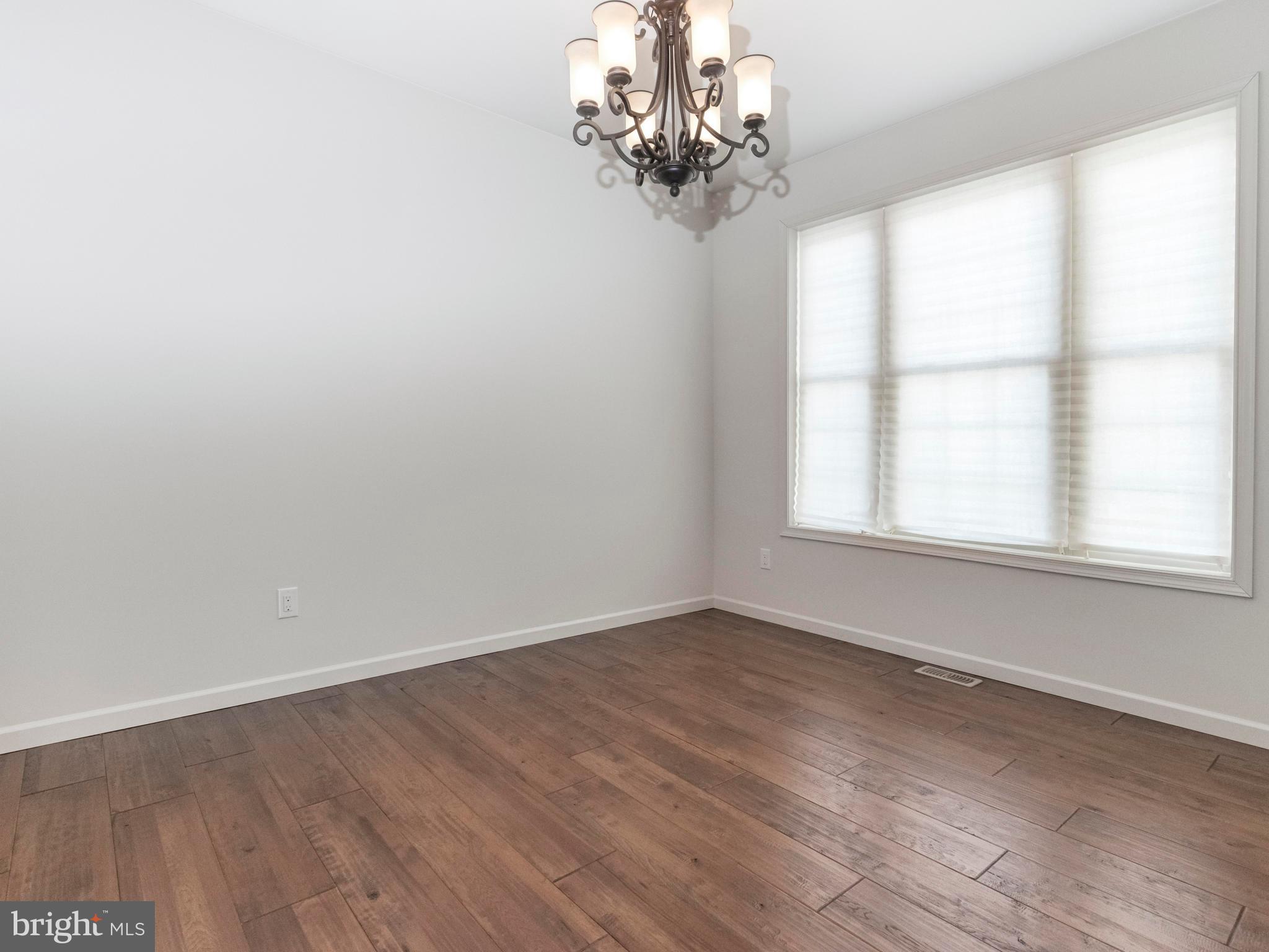 712 Bee Ridge Path Cochranville, PA 19330 - Photo 26 of 27 Formal Dining Room With Hardwood Flooring