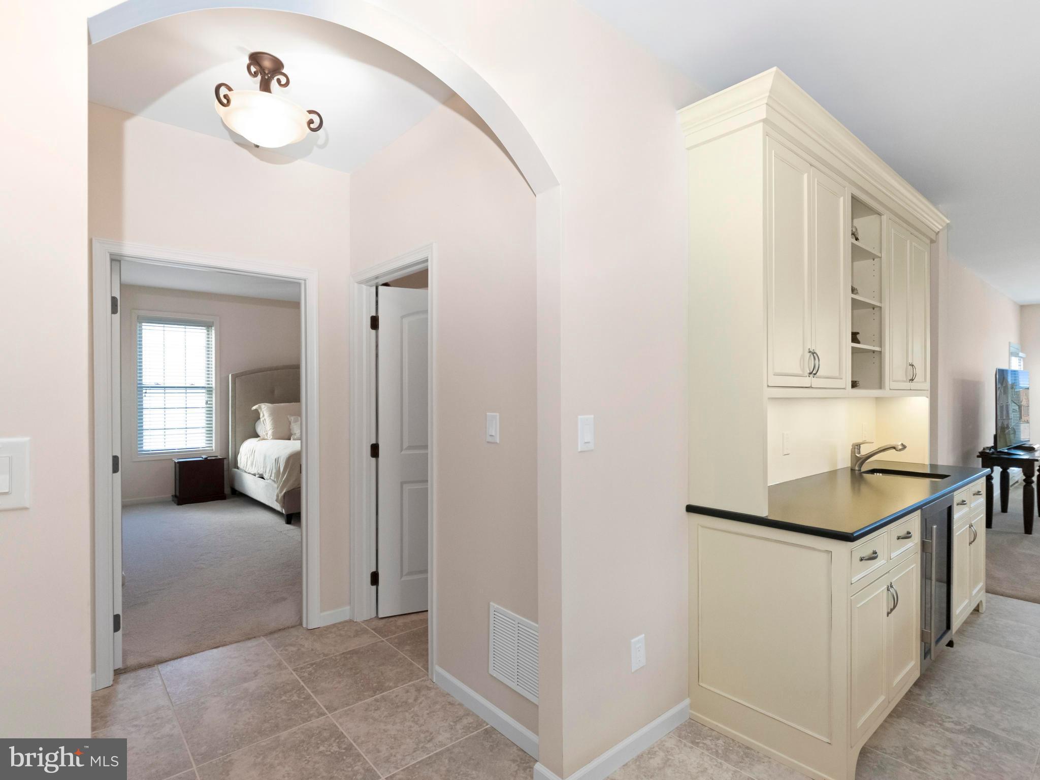 712 Bee Ridge Path Cochranville, PA 19330 - Photo 4 of 27 Arched Hall Opening leading to Owners Suite