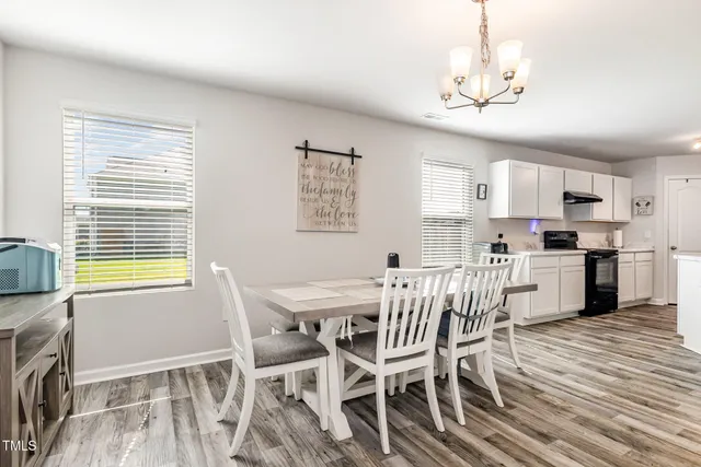 a view of yard with swimming pool and seating