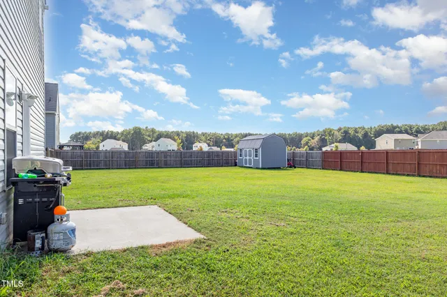 a en suite bathroom with a double vanity sink and a mirror