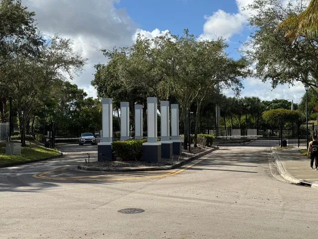 a view of a fountain in front of a house