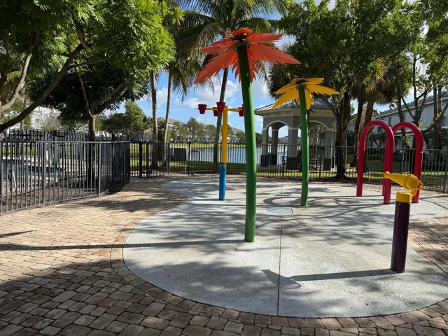 a view of a park with iron fence