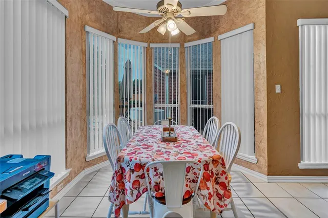 a dining room with furniture and window